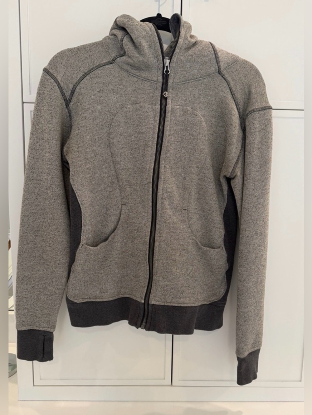 Lululemon women’s gray zip up hoodie. Size 6. Small stain on hand cuff.